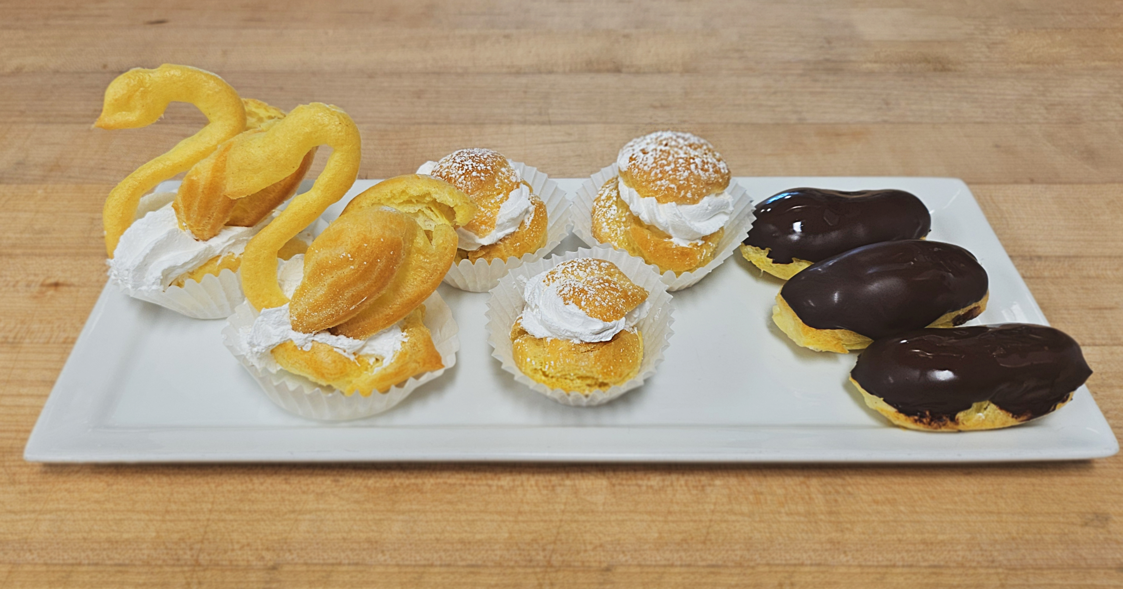 Choux swans, cream puffs, and chocolate eclairs